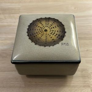 New Decorative ceramic catchall with lid. Beige with sea urchin. 3.75”x3.75”x2”.
